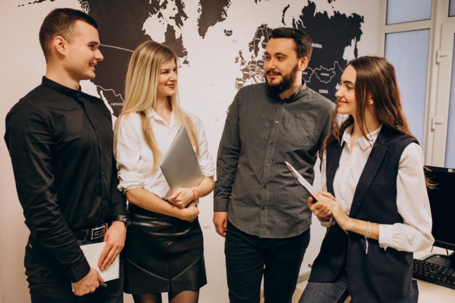 Professional analysing economic data trends on multiple screens