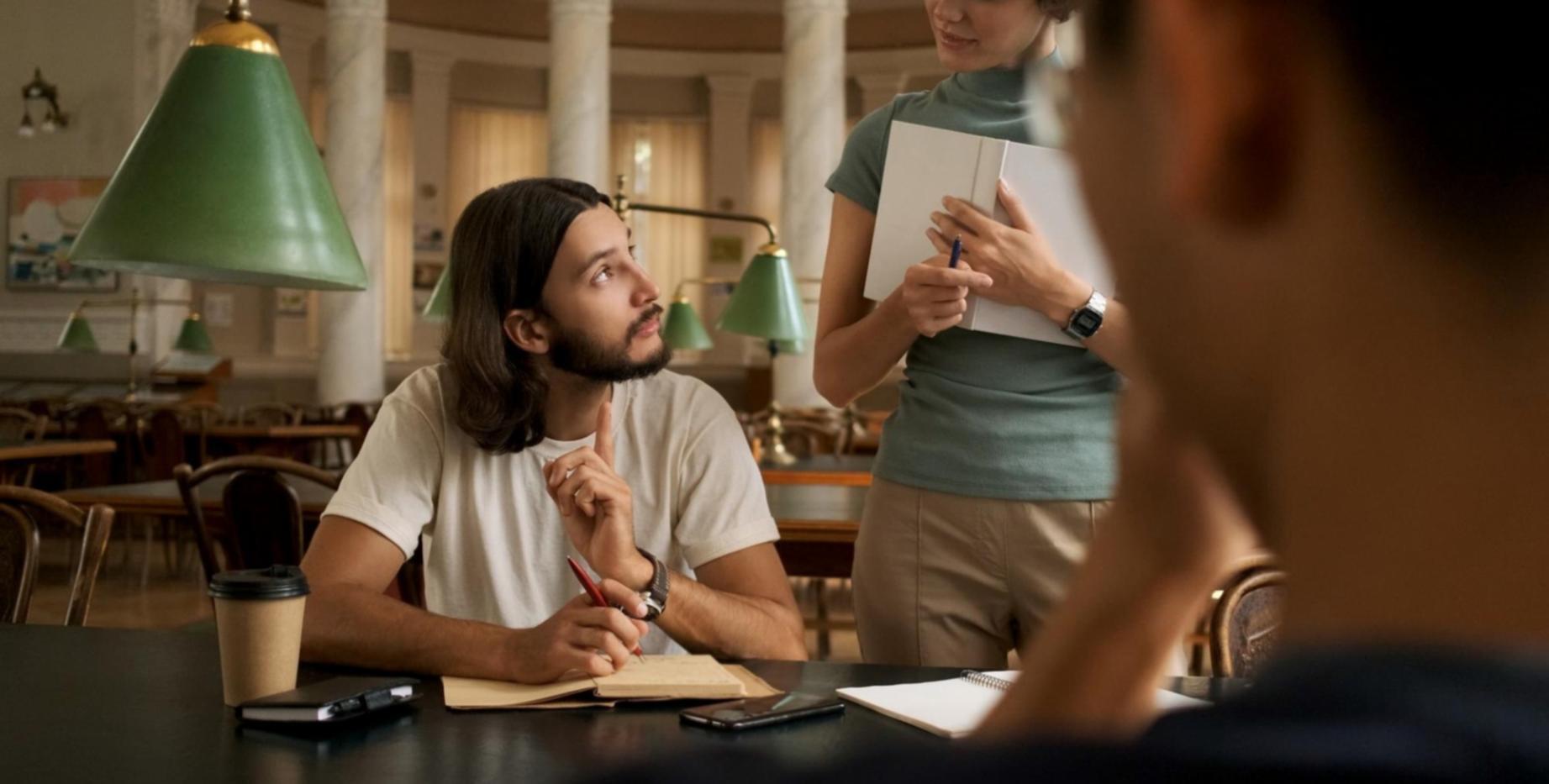 Financial analyst reviewing economic data charts and graphs on computer screens